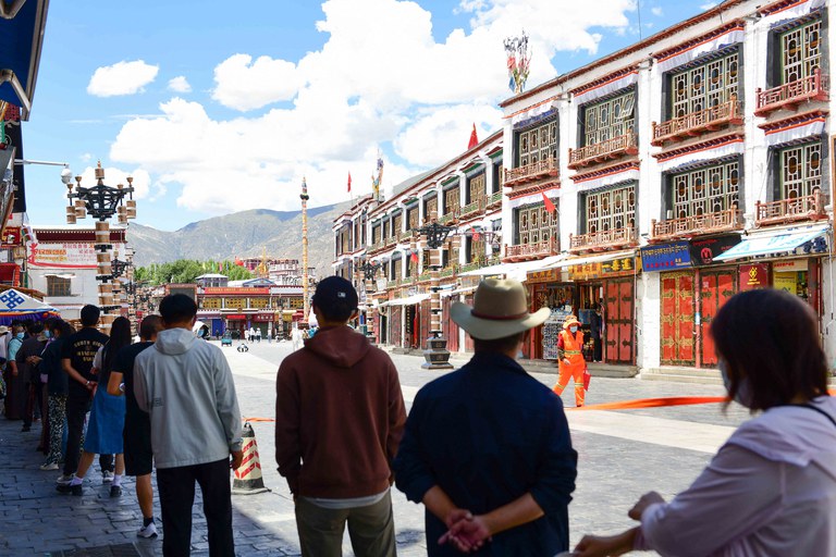 People line up to undergo nucleic acid tests for COVID-19 on Aug. 9, 2022, in Lhasa, in China's western Tibet Autonomous Region. Credit: CNS/AFP