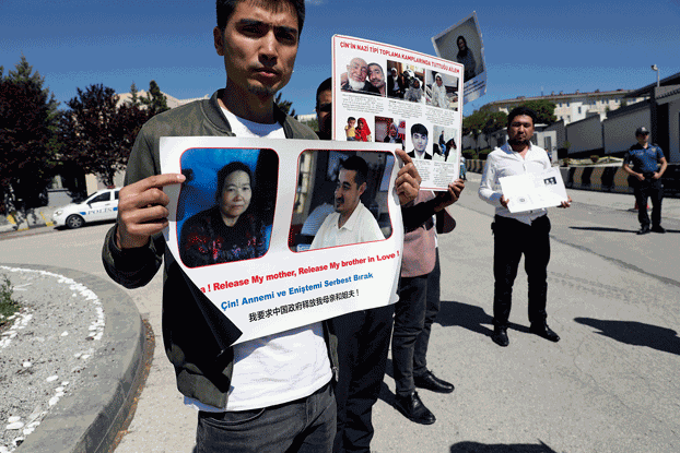 Uyghur Turks, who say they haven't heard any news of their relatives in northwest China's Xinjiang region, attend a protest near the Chinese Embassy in Ankara, Turkey, May 24, 2022. Credit: Associated Press