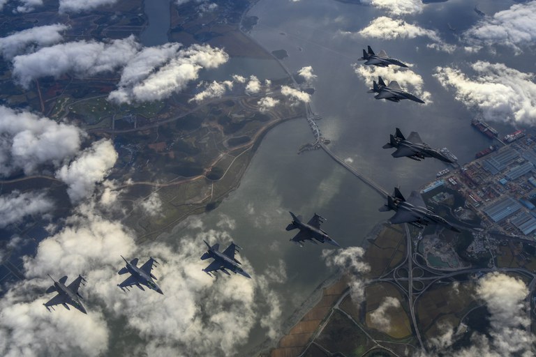 In this photo provided by South Korea Defense Ministry, South Korean Air Force's F15K fighter jets and U.S. Air Force's F-16 fighter jets, fly in formation during a joint drill in an undisclosed location in South Korea, Tuesday, Oct. 4, 2022.  Credit: South Korea Defense Ministry via AP