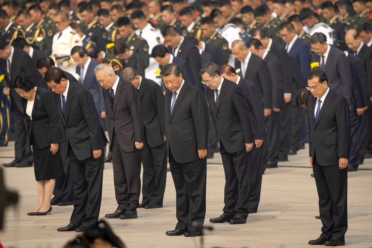 Chinese President Xi Jinping, center, and other Chinese leaders bow during a ceremony to mark Martyr's Day at the Monument to the People's Heroes at Tiananmen Square in Beijing, Sept. 30, 2022. Credit: Associated Press