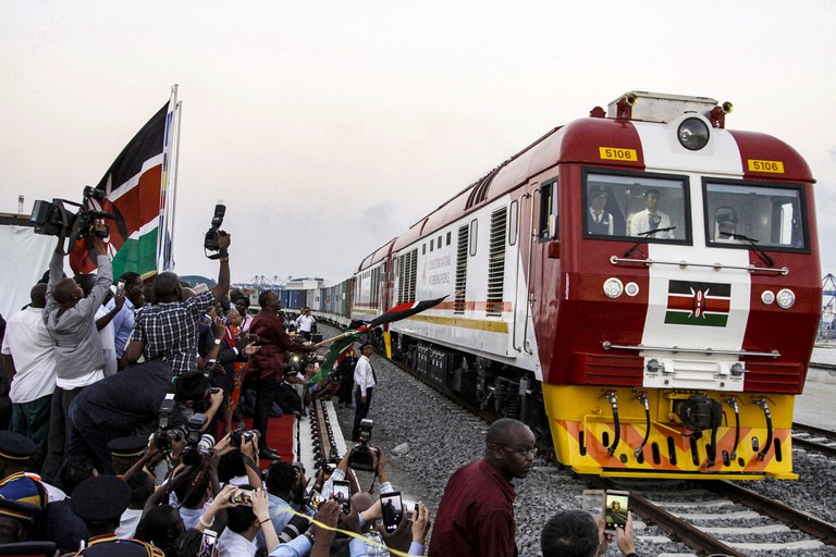 In this May 30, 2017, file photo, the SGR cargo train travels from a port container depot on a Chinese-backed railway costing nearly $3.3 billion - one of the country's largest infrastructure projects since independence - in Mombasa, Kenya. In the past couple of years, Beijing has become more conservative in its approach to its African investments, says Joseph Asunka, CEO of pollsters Afrobarometer. Credit: AP