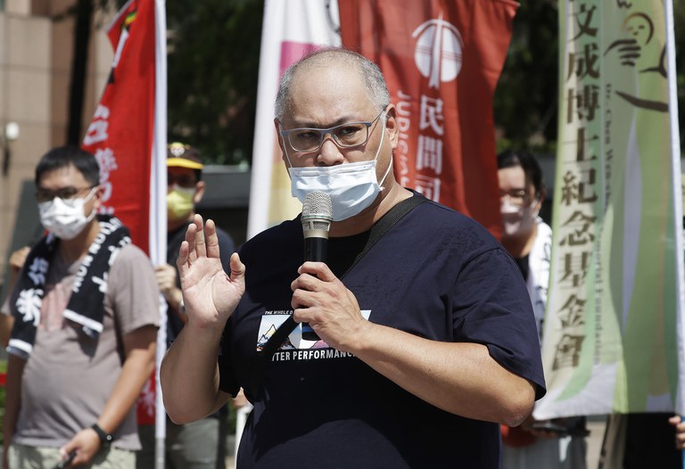 Lee Ming-Cheh, a Taiwanese pro-democracy activist, detained by Chinese authorities in late March 2017, delivers a speech during a protest against China on human rights on the eve of China's National Day in front of the Bank of China in Taipei, Taiwan, Sept. 30, 2022. Credit: AP