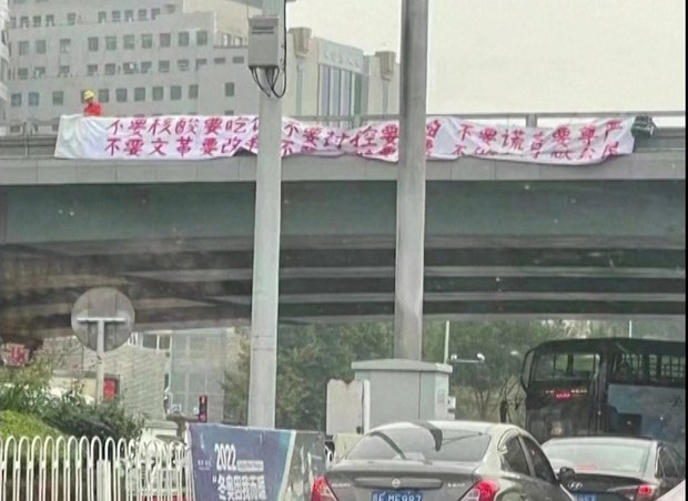 Beijing banner protester lauded as China's new Tank Man, or 'Bridge Man'