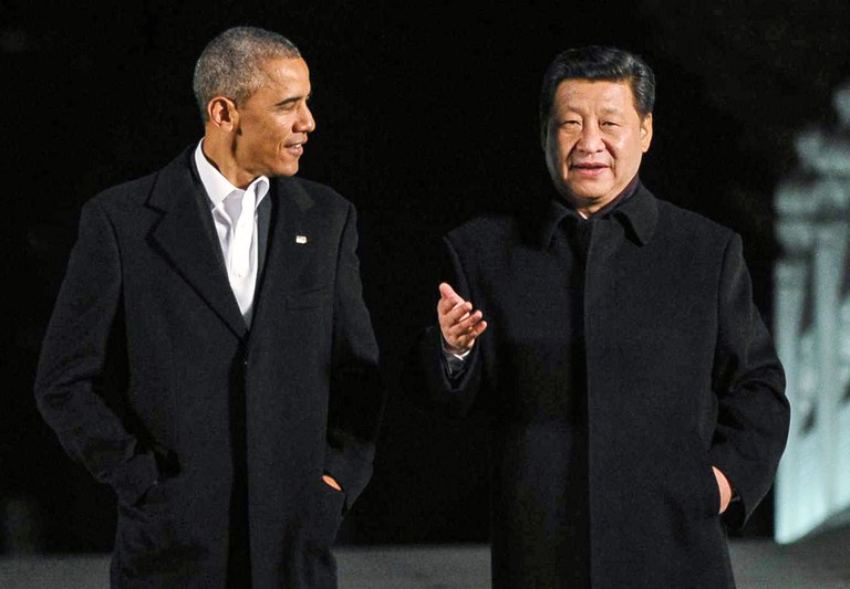 U.S. President Barack Obama walks with China's President Xi Jinping at the Zongnanhai leaders compound ahead of a dinner, Nov. 11, 2014 in Beijing, China. Credit: Associated Press