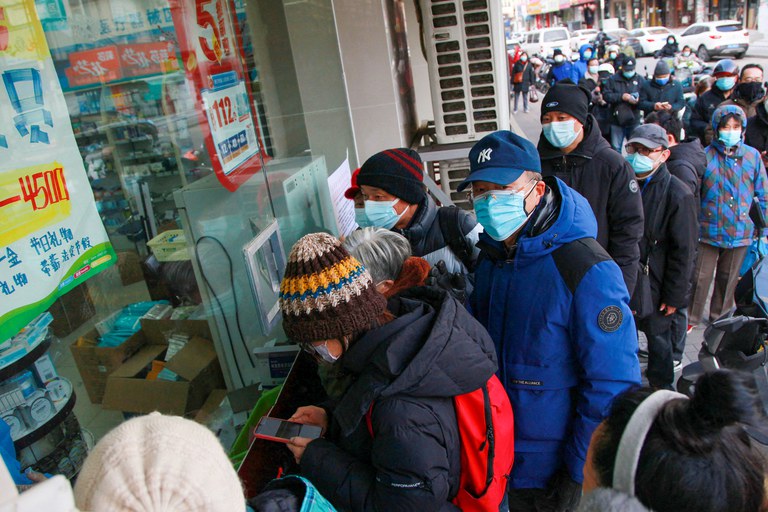 People line up to buy medicine at a pharmacy in Nanjing, in China's eastern Jiangsu province on Tuesday, Dec. 20, 2022. Credit: AFP