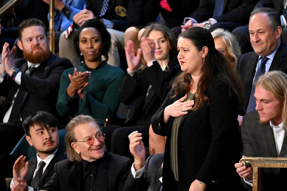 Ukraine's ambassador to the United States, Oksana Markarova, stands for applause, as State of the Union attendees including Second Gentleman Doug Emhoff and Irish music star Bono clap. Photo: AFP