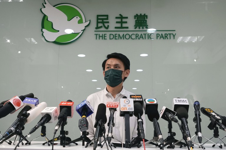"All we wanted to do was eat together – it was just a meal," says Democratic Party chairman Lo Kin-hei, shown at a 2021 press conference in Hong Kong. Credit: Associated Press