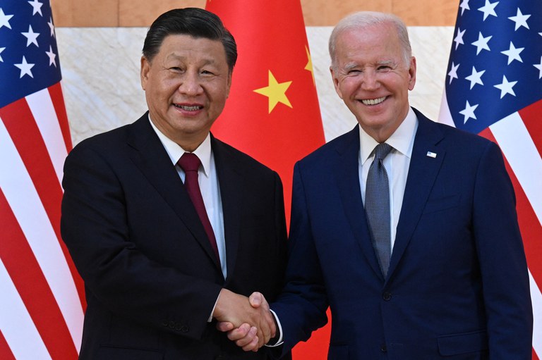 US President Joe Biden (R) and China's President Xi Jinping (L) shake hands as they meet on the sidelines of the G20 Summit in Nusa Dua on the Indonesian resort island of Bali, Nov. 14, 2022. Credit: AFP