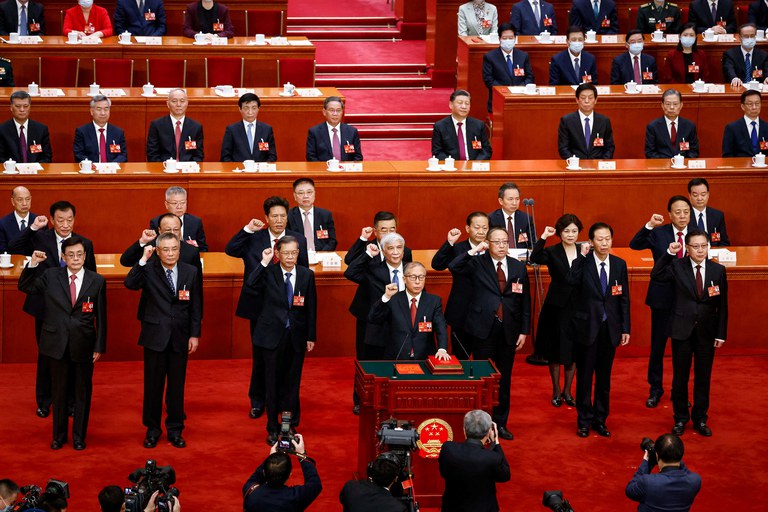 Newly elected delegates take their oaths during the Third Plenary Session of the National People's Congress at the Great Hall of the People, in Beijing, Friday, March 10, 2023.     Credit: Pool via Reuters