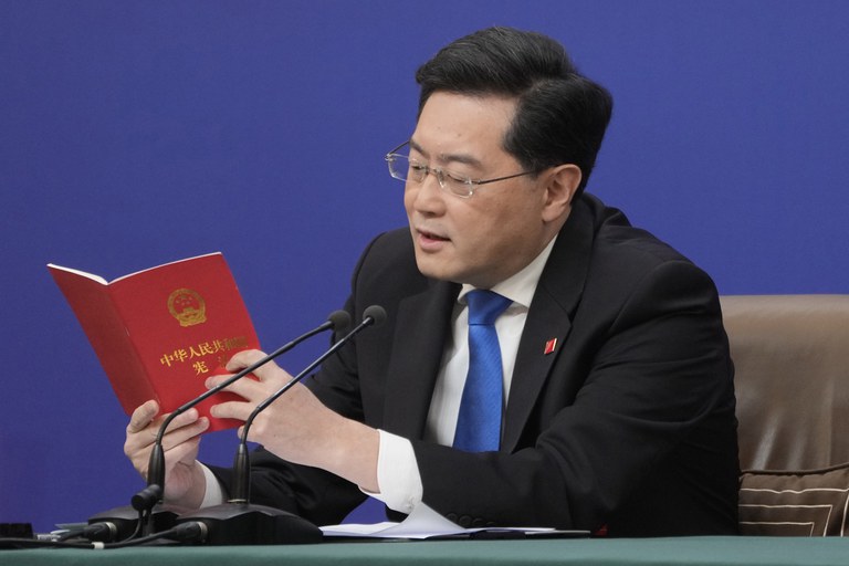 Chinese Foreign Minister Qin Gang reads from the Chinese constitution when answering a question about Taiwan during a press conference held on the sidelines of the annual meeting of China's National People's Congress in Beijing, Tuesday, March 7, 2023. Credit: Associated Press