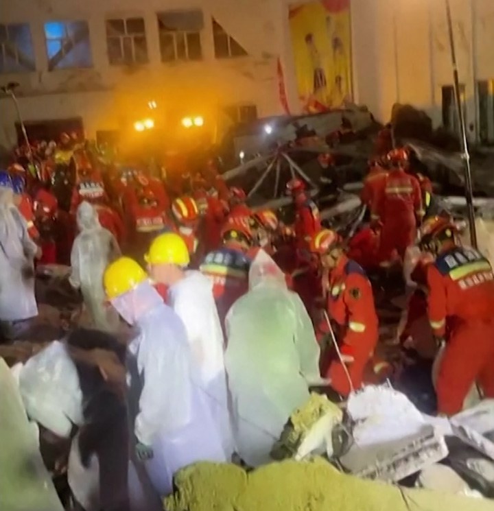 Rescuers search for trapped victims at the site of a school gymnasium roof collapse at Qiqihar No. 34 Junior High School in Qiqihar, in northeast China's Heilongjiang province , July 24, 2023. Credit: Screenshot from video obtained by Reuters