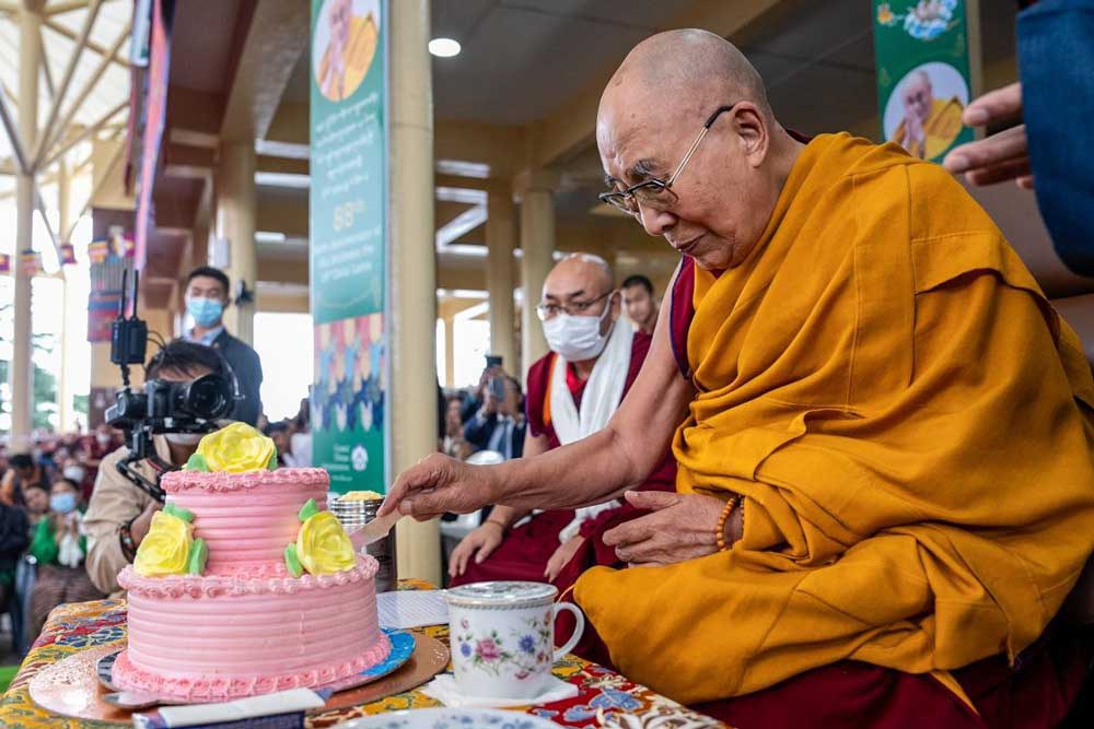 The Dalai Lama cuts a birthday cake presented to him during the celebration of his 88th birthday at his residence in Dharamsala, India, on Thursday, July 6, 2023. Credit: Tenzin Choejor