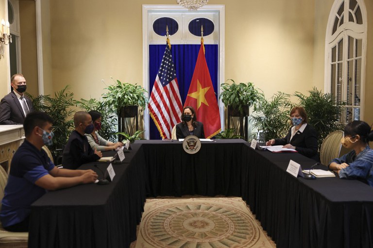 U.S. Vice President Kamala Harris (C) meets with civil society change makers who work on LGBT, transgender, disability rights and climate change, at the U.S. Chief of Mission's residence in Hanoi, Vietnam, Aug. 26, 2021. Credit: Evelyn Hockstein / Pool / AFP
