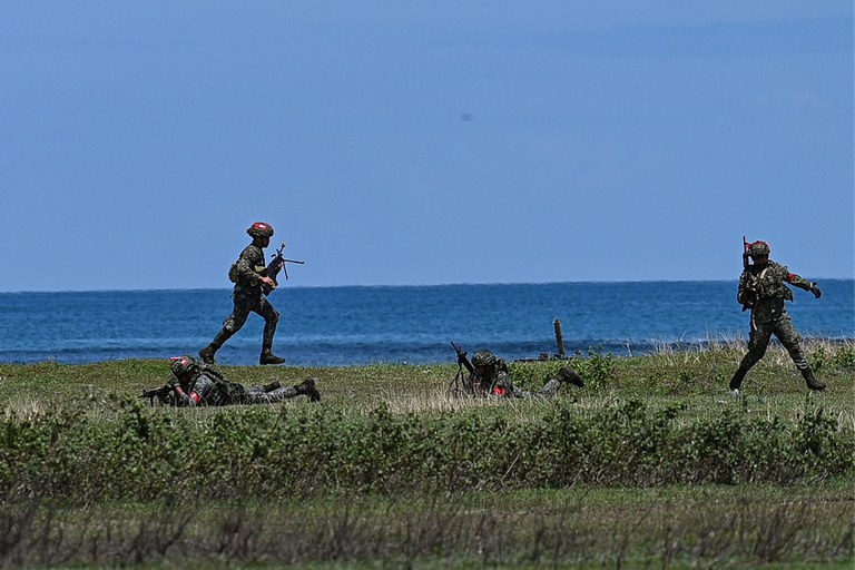 Soldiers participate in a combat exercise as a part of the Indo-Pacific Endeavor 2023 between the Armed Forces of the Philippines and the Australian Defense Force in Tarampitao Airfield in Rizal, Palawan, Philippines, Aug. 21, 2023. Credit: Jam Sta Rosa/AFP