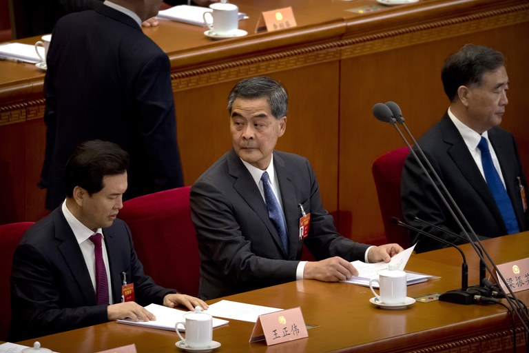 Former Hong Kong leader Leung Chun-ying [center], who is vice chairman of the Chinese People's Political Consultative Conference, posted on Facebook, "Sheep Village is not giving up. Parents should pay attention." He is pictured at a plenary session of the conference in Beijing in 2019. Credit: Mark Schiefelbein/AP