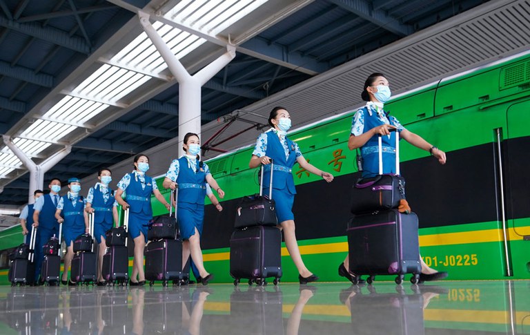 Workers prepare to board a train on the Laos-China Railway at Kunming South Railway Station in Kunming, southwest China's Yunnan province, July 16, 2023. The rail line connects Kunming with Vientiane in Laos. Credit: Chen Xinbo/Xinhua via Getty Images