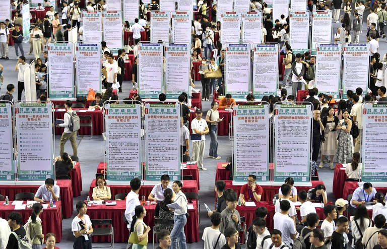 People attend a job fair for university graduates at a gymnasium in Hefei, Anhui province, Sept. 4, 2023. China’s youth unemployment was above 20% before the government stopped publishing that statistic in August. Credit: China Daily via Reuters
