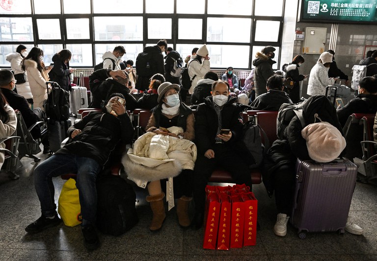 Passengers wait for their train to arrive at Beijing West railway station ahead of the Lunar New Year in Beijing on Jan. 21, 2023. Credit: Noel Celis/AFP