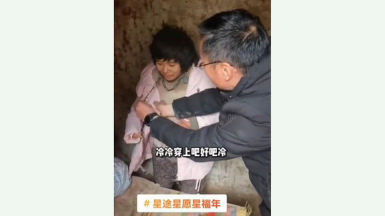 A woman, identified by authorities as Yang Qingxia, but known by her nickname Xiaohuamei, was found chained in a shed in China’s Feng county in 2022. Credit: Screenshot from video