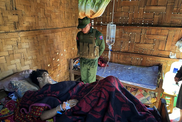 A member of Myanmar National Democratic Alliance Army with an injured soldier following the fighting with Myanmar junta military in northern Shan state. Credit: Kokang311@ facebook