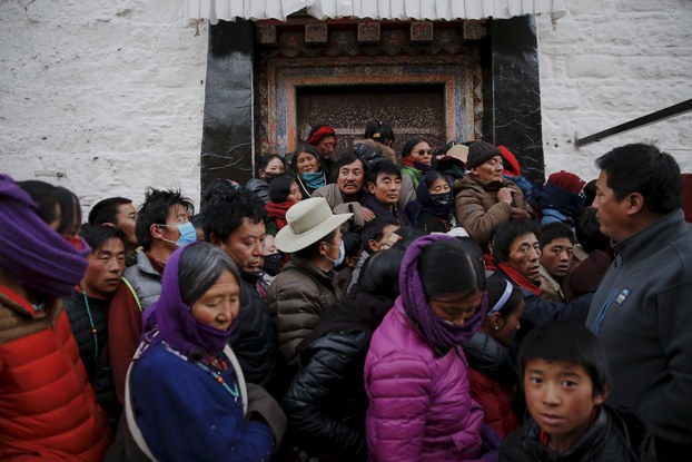 Pilgrims wait to enter the Jokhang Temple in central Lhasa, capital of western China's Tibet Autonomous Region, Nov. 20, 2015. (Damir Sagolj/Reuters)