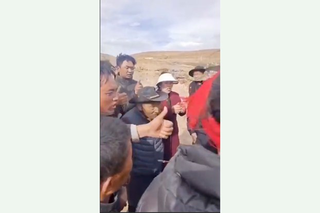 Chinese police argue with Tibetans protesting the seizure of pasture land in Markham county in western China's Tibet Autonomous Region, April 10, 2024. (Citizen journalist/video screenshot)